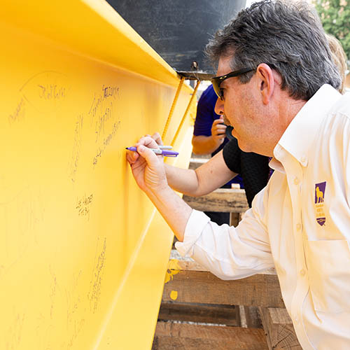 president kitts signing beam