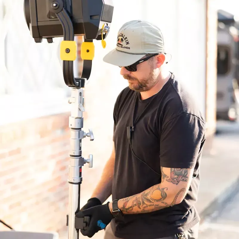 On-set crew setting up lighting