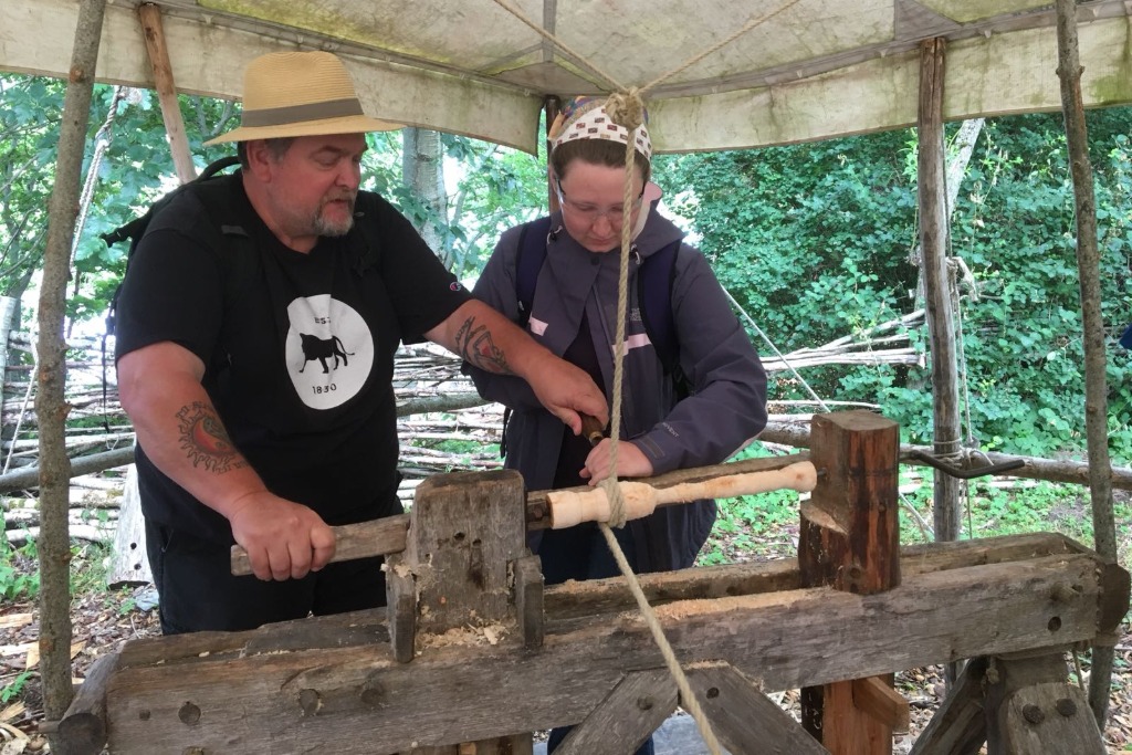 Student woodworking with a craftsman in Scotland