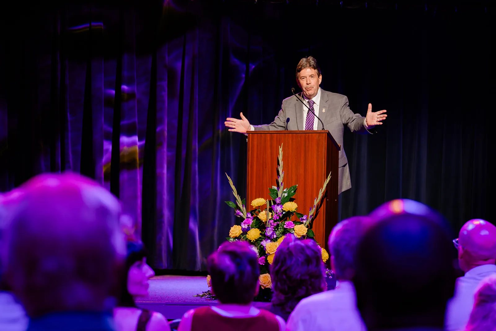 President Kitts speaking on stage