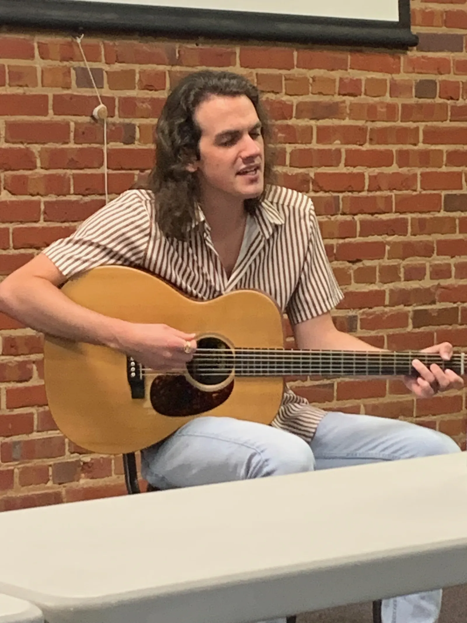 A guitar player sings #1