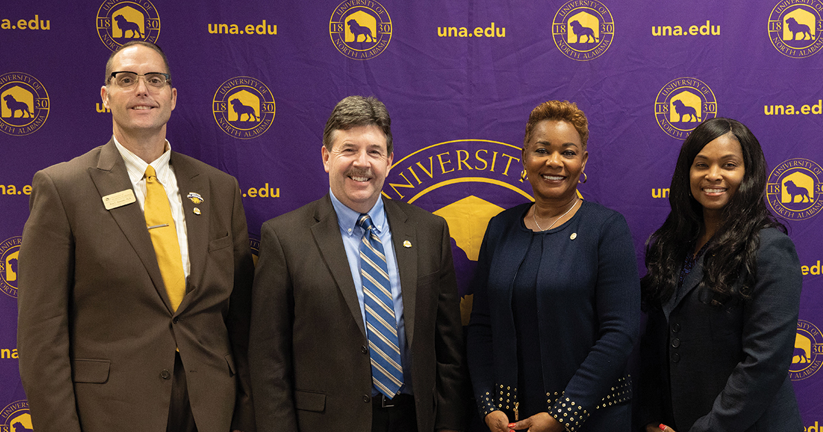 President Ken Kitts and Provost and Executive Vice President for Academic Affairs Ross Alexander pose with Drake State Community and Technical College President Patricia Sims. 