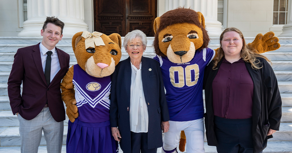 Governor Kay Ivey poses with mascots Leo and Una as well as SGA President Amber Sandvig at the capitol in Montgomery.