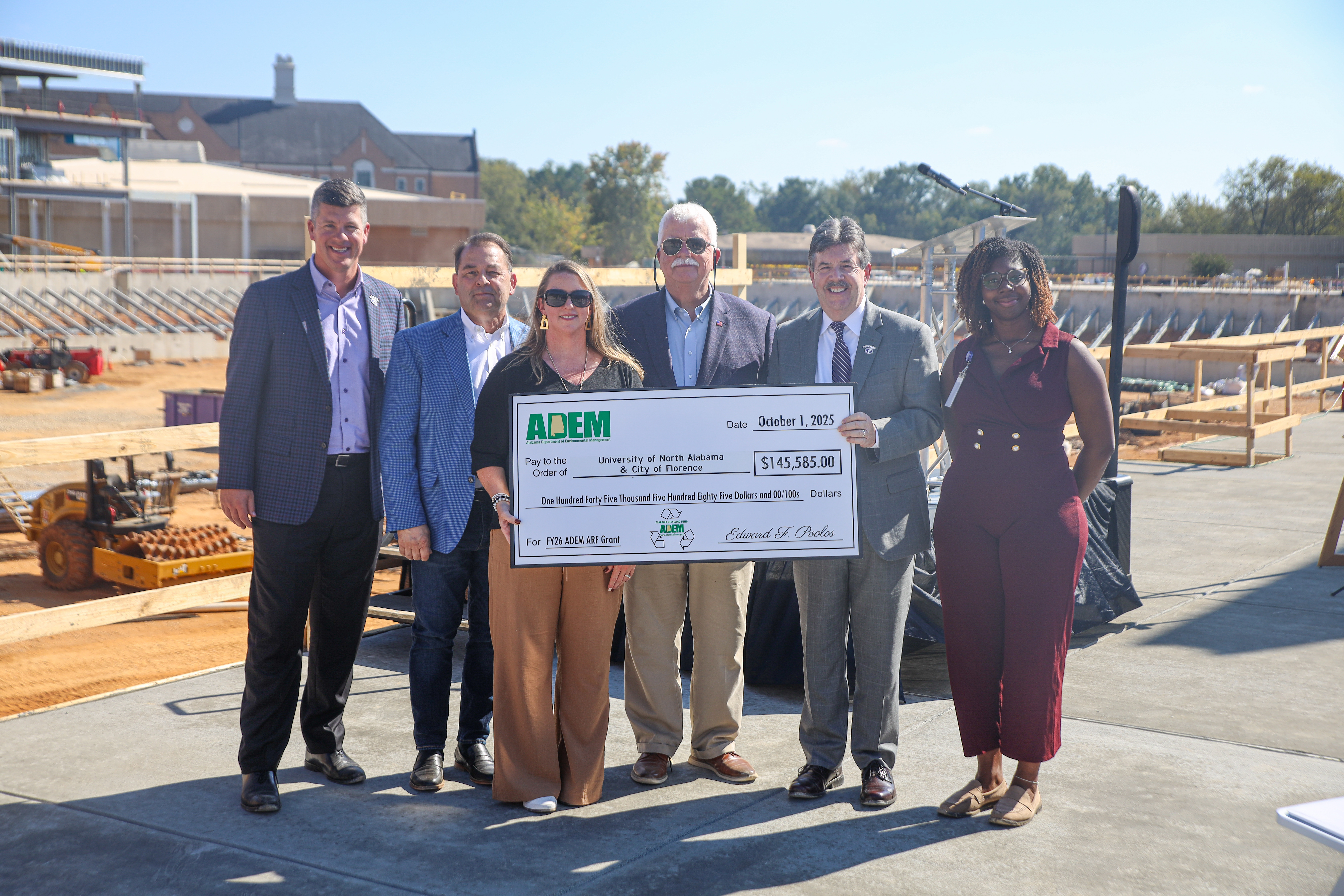 Representatives from UNA, the City of Florence, and the Alabama Department of Environmental Management were at Bank Independent Stadium today for a check presentation.