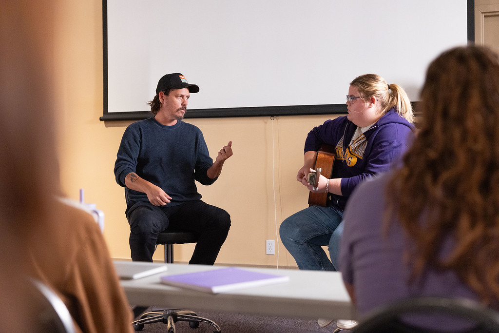 John Paul White instructs a student as part of his role as a faculty member in the David and John Briggs Family Department of Entertainment Industry.
