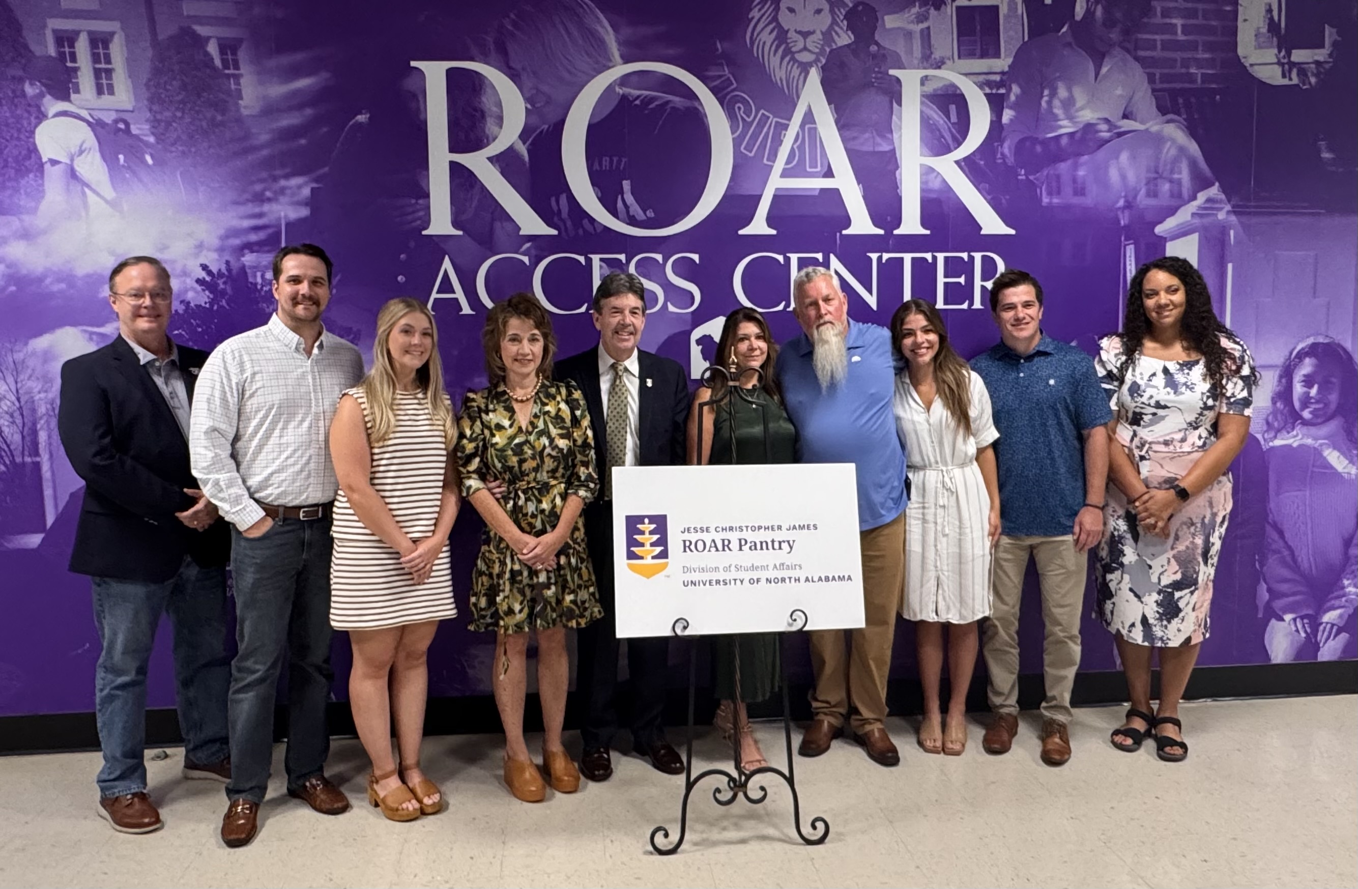 Members of the Jesse Christopher James Family are joined by President Kitts, Mrs. Kitts, and other members of the UNA community for the naming ceremony of the ROAR Pantry in memory of Jesse.