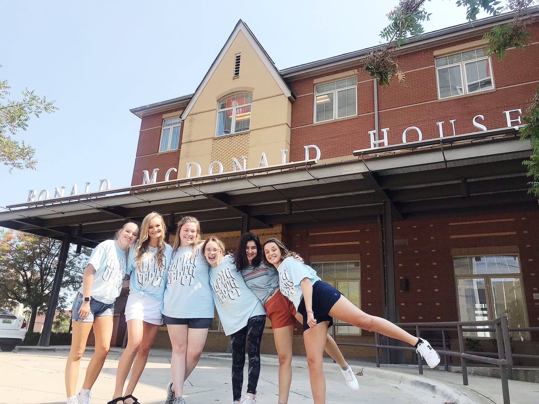 Members of Alpha Delta Pi pose for a photo outside of the Ronald McDonald House Charities.
