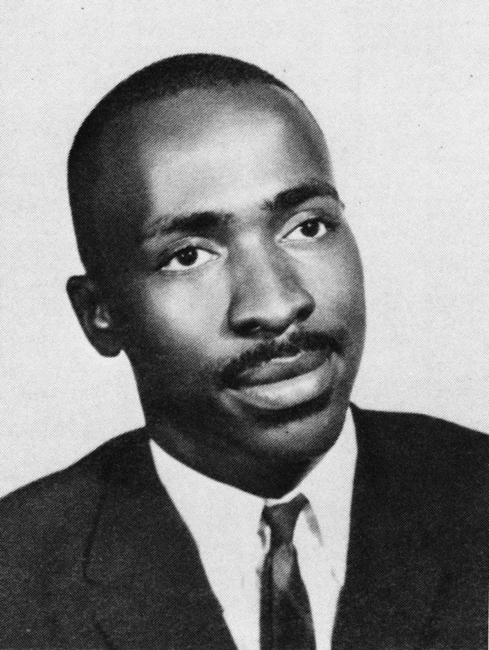 Class portrait of Wendell Gunn as a student, in a dark suit and tie