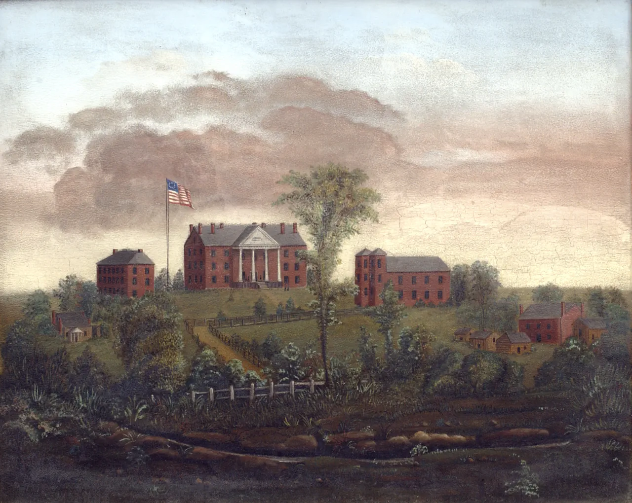 Painting of LaGrange College on its mountaintop site: a columned brick main building flanked by two smaller brick halls, a United States flag flying before it, with outbuildings and a fenced lane on the slope below